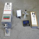 A mid 20th century optician's revolving test chart, 104cm high,