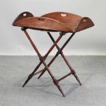 A George III mahogany butler's tray, on stand,