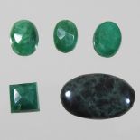 A collection of four natural unmounted emeralds,