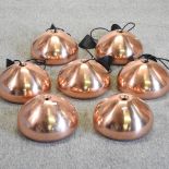 A set of five Tom Dixon copper coloured ceiling lights,