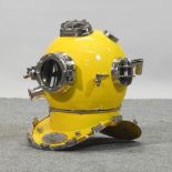 A yellow painted life size metal diver's helmet