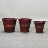 A set of three reproduction Coca-Cola graduated advertising buckets,