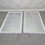 A pair of white painted window frame wall mirrors,