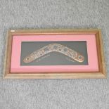 A Lauren Jarrett aboriginal painted boomerang, in a display frame,