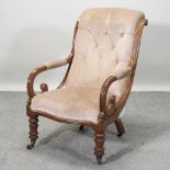 A Victorian beige upholstered armchair,