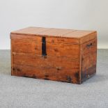 An antique pine trunk, with metal handles,