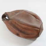 An early 20th century leather punch ball,