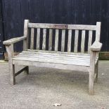 A wooden slatted garden bench,