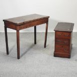 A George III mahogany folding games table, together with a Victorian pedestal,
