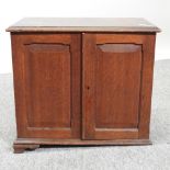 A Victorian oak specimen cabinet, containing six glazed drawers,