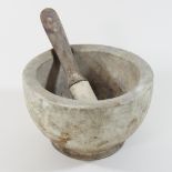 A marble pestle and mortar,