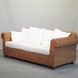 A wicker Lakeland sofa, 204cm, together with a pair of matching armchairs,