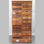 An early 20th century bank of drawers, containing two rows of eighteen drawers,