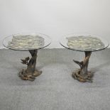 A pair of carved and gilt wood occasional tables, each of organic form, with circular glass tops,