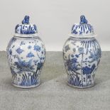 A pair of Chinese blue and white porcelain ginger jars and covers,