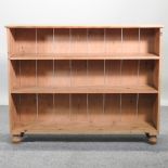 An antique pine dwarf open bookcase,