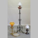 A wrought iron standard oil lamp,
