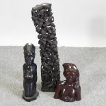 An African carved wooden figure group, 64cm high,