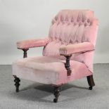 A Victorian pink upholstered button back armchair