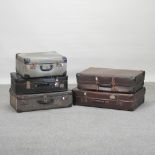 A collection of five vintage suitcases,