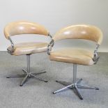 A pair of 1970's tubular chrome and tan upholstered armchairs