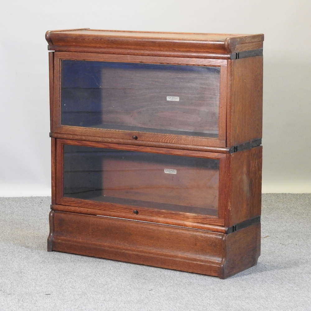 A Globe Wernicke glazed oak two tier sectional bookcase,