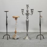 A 19th century cast iron candlestick, 66cm high,