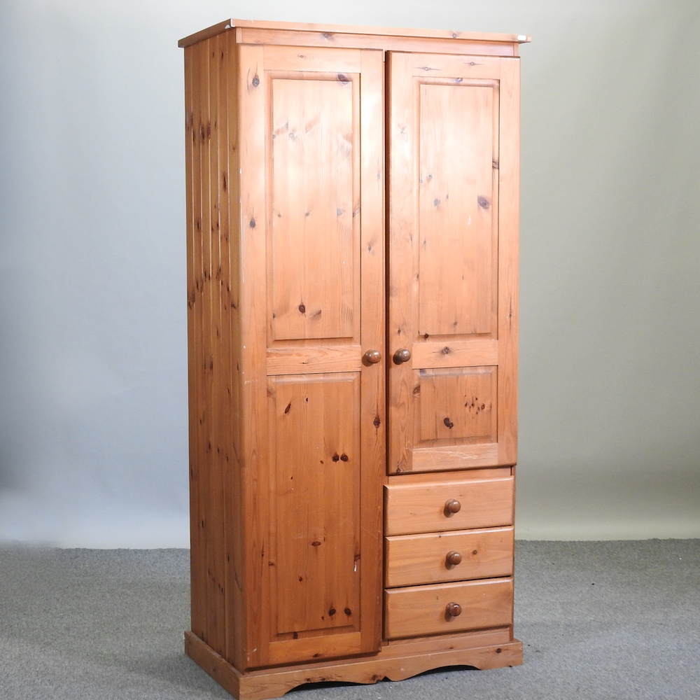 A modern pine single wardrobe,