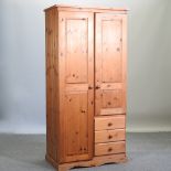 A modern pine single wardrobe,