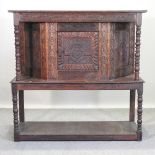 A 19th century carved oak side cabinet, on stand,