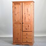 A modern pine single wardrobe,