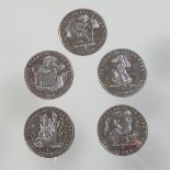 A collection of five Beatrix Potter crowns,