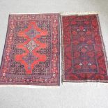 A small woollen rug, with three central medallions, on a red ground, 167 x 113cm,