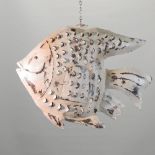 A hanging metal candle cage in the form of a fish,