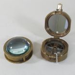 A reproduction brass brunton compass,