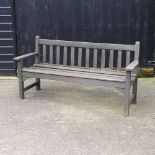 A wooden slatted garden bench,