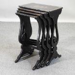 A 19th century nest of four black lacquered occasional tables,