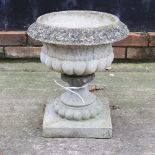 A reconstituted stone garden urn,