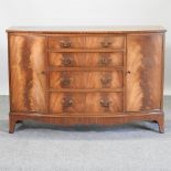 A mid 20th century walnut bow front sideboard,