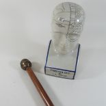A reproduction phrenology head, together with a Buddha walking stick,
