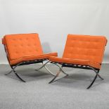 A pair of Barcelona style chairs,