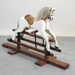 A Victorian style rocking horse, on stand,