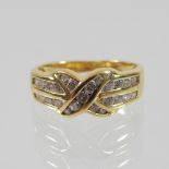 An 18 carat gold and diamond ring, of crossover design,