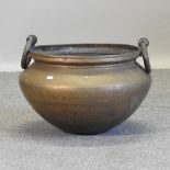 A brass cooking pot,