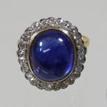 A large unmarked sapphire and diamond cluster ring,
