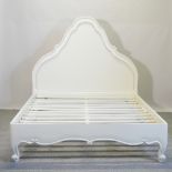 A French style white painted double bedstead, with a slatted base,