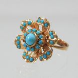 An unmarked turquoise cluster ring,