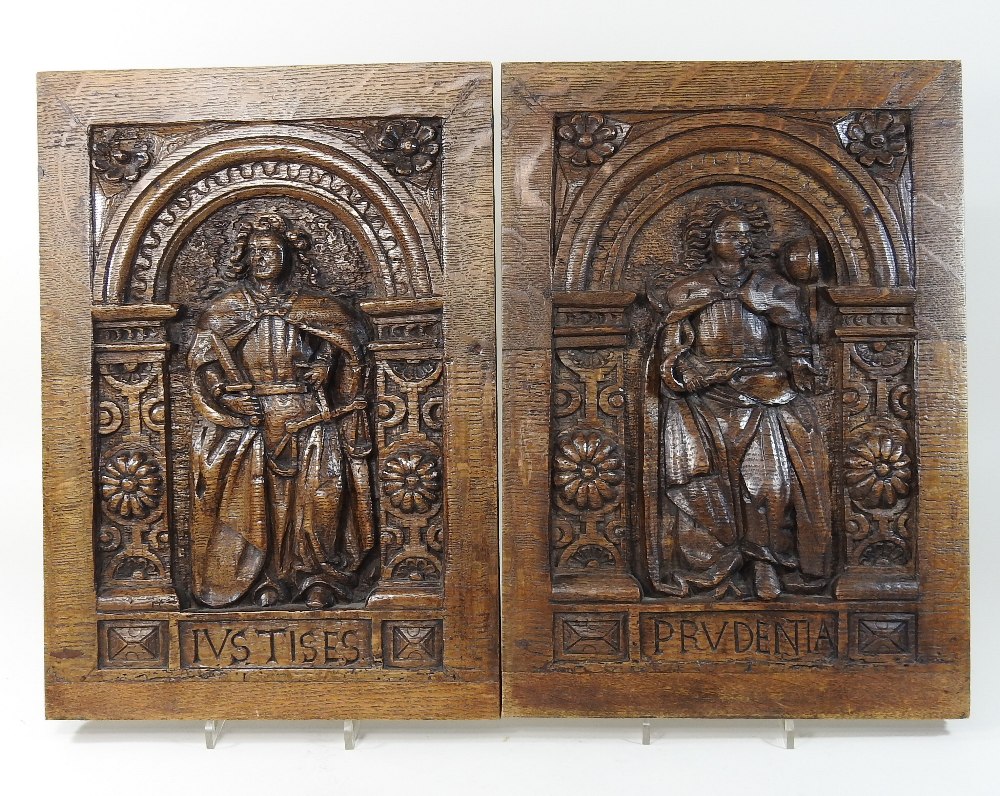 A pair of 18th century carved oak panels, Ivstises (justice) and Prvdentia (prudence),