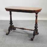 A Victorian walnut card table,