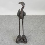 An oriental bronze model of a water bird,